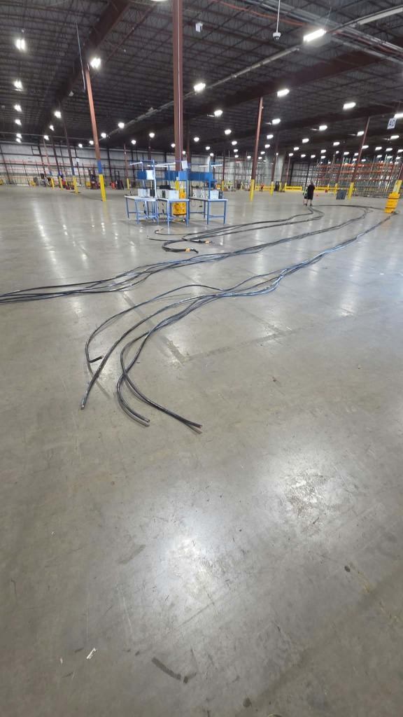 Professional electrician diagnosing circuit wiring and troubleshooting electrical problems